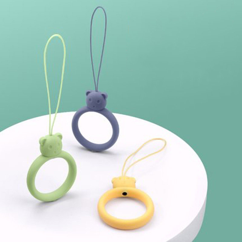 A silicone lanyard for a phone bear ring on a finger bottle green